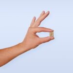 ‘맞춤형 영양’이 뜬다…함께 챙기는 셀프 건강 루틴 A person's hand with a ring on it